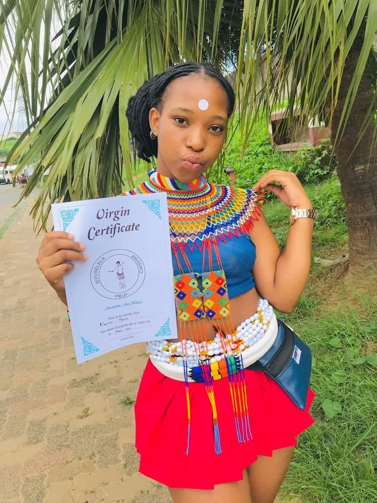 Beautiful Lady Proudly Flaunts Her Certificate Of Virginity