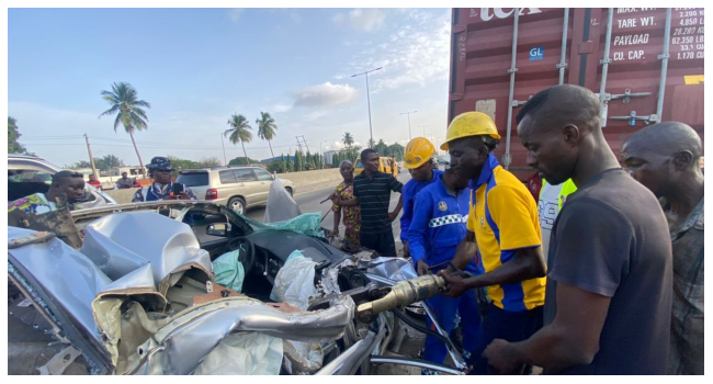One Dead As Car Collides With Truck At Isolo Under Bridge, Lagos [Photo]