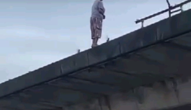 Passersby With Smartphones Watch As Woman Jumps To Death From Flyover In Delta State