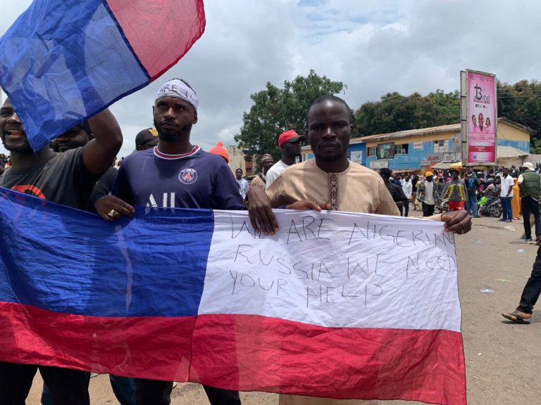 Russian, Japanese Flags Spotted In Jos Amid #EndBadGovernance Protest