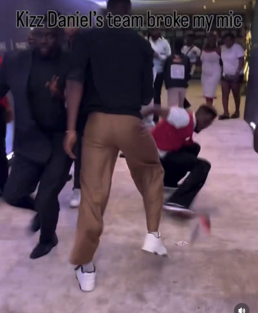 Kizz Daniel’s Security Pushes Reporter To The Ground After He Tried To Get An Interview From The Singer (Video)